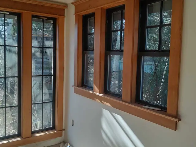 Craftsman-style stained fir window casing and trim work near Sandy, OR — Devine Home Remodeling & Construction