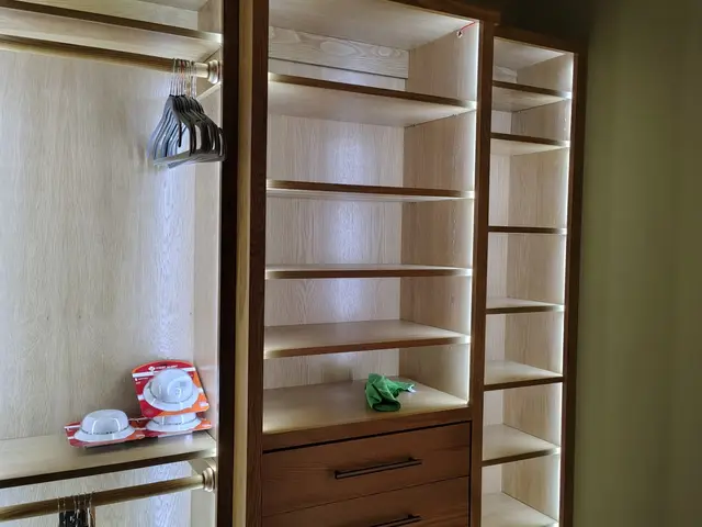 Custom closet drawers and adjustable shelving with integrated lighting near Estacada, OR — Devine Home Remodeling & Construction
